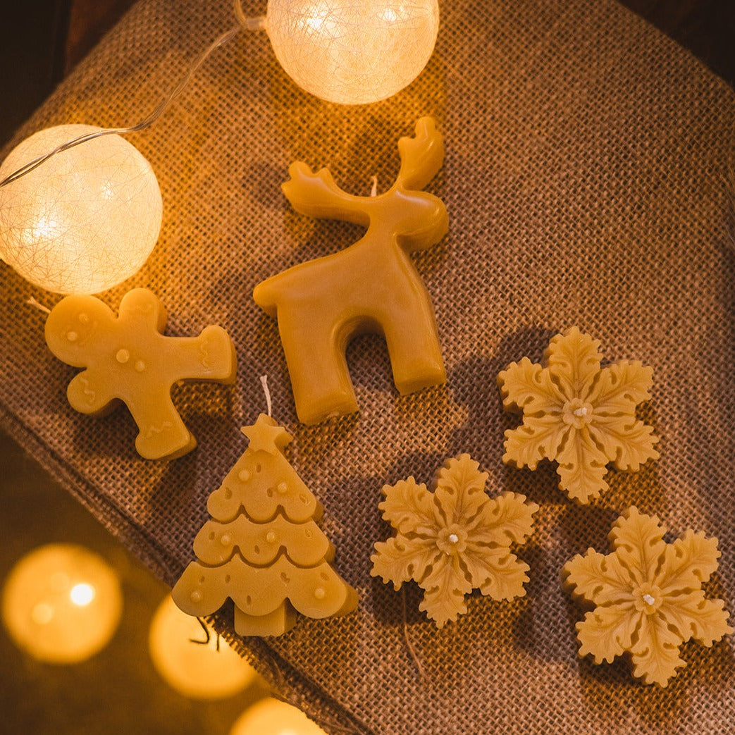 Beeswax Reindeer Christmas Candle with festive background