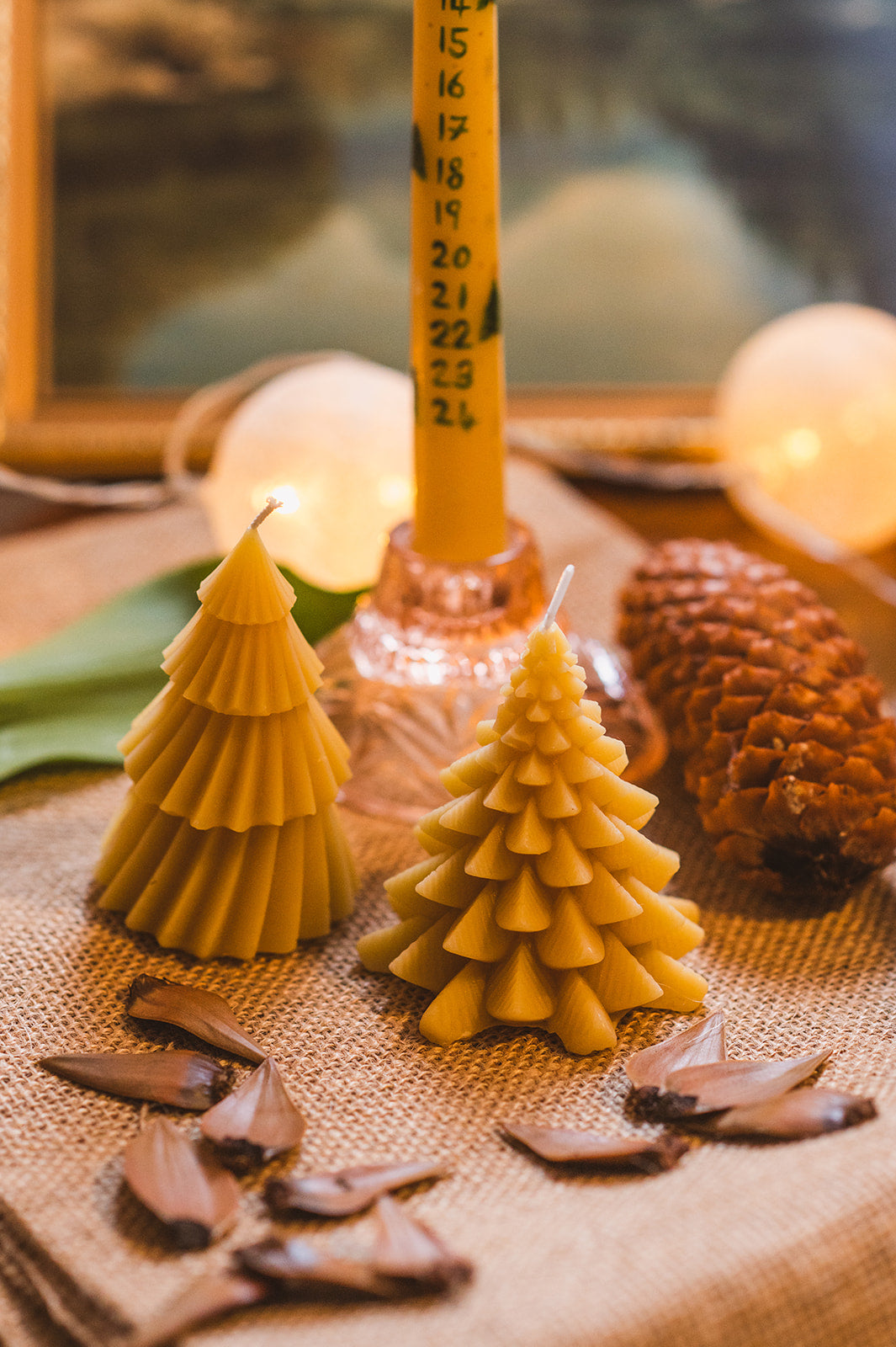 Beeswax Traditional Christmas Tree Candle with festive background