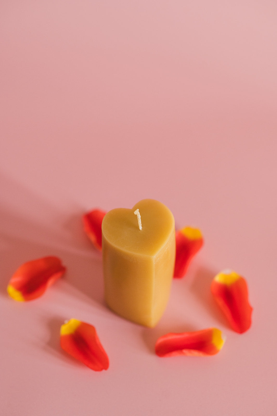 Tall Heart Shaped Beeswax Candle with rose petals 